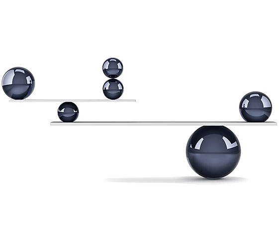Image of 6 balls of varying sizes balancing on one another