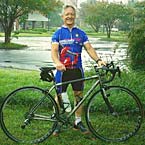 Kohlerackels employee holding a bicycle.