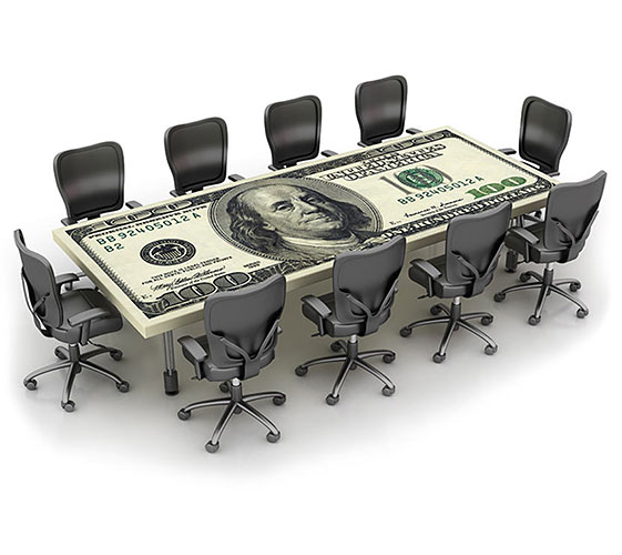 Image of a table in the style of a $100 bill surrounded by chairs